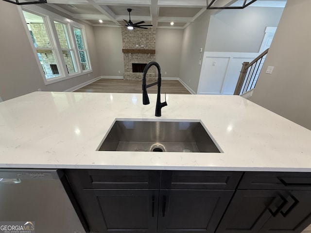 73 Hewett Rd, Pendergrass, GA 30567 - kitchen featuring a sink, coffered ceiling, dark cabinetry, ceiling fan, and stainless steel dishwasher