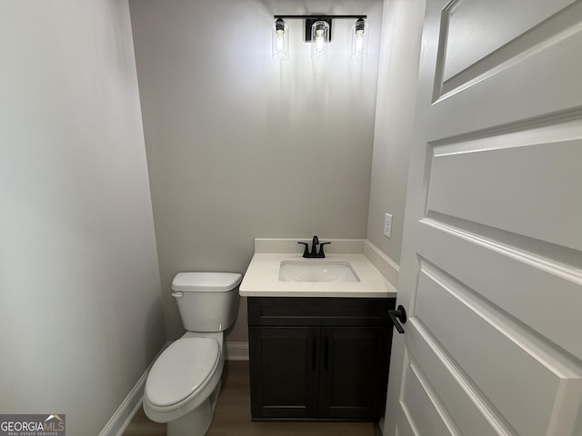 73 Hewett Rd, Pendergrass, GA 30567 - half bath with toilet, vanity, and baseboards