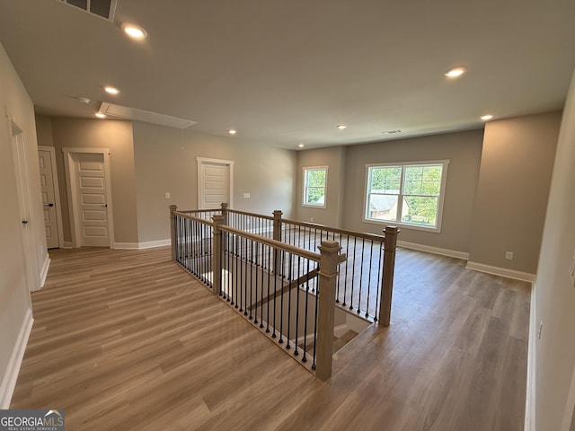 73 Hewett Rd, Pendergrass, GA 30567 - corridor with attic access, an upstairs landing, wood finished floors, baseboards, and recessed lighting