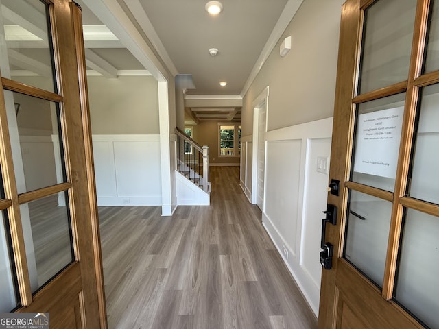 73 Hewett Rd, Pendergrass, GA 30567 - corridor featuring a decorative wall, wood finished floors, a wainscoted wall, stairway, and ornamental molding