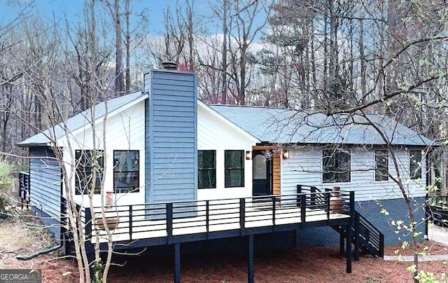 137 Creekview Dr, Woodstock, GA 30188 - view of property exterior featuring a deck and a chimney