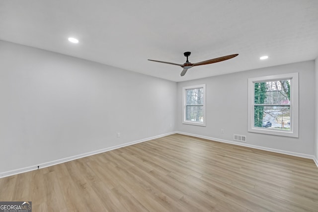 unfurnished room with visible vents, baseboards, ceiling fan, recessed lighting, and light wood-style flooring