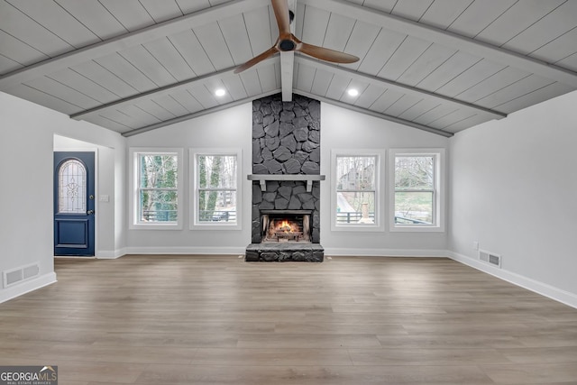 137 Creekview Dr, Woodstock, GA 30188 - unfurnished living room with plenty of natural light, a stone fireplace, ceiling fan, wood finished floors, and wood ceiling