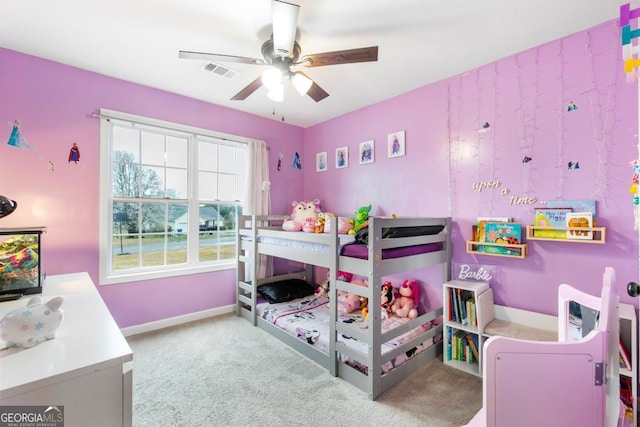 bedroom featuring carpet flooring, baseboards, visible vents, and ceiling fan