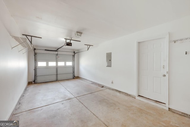 garage with electric panel, baseboards, and a garage door opener