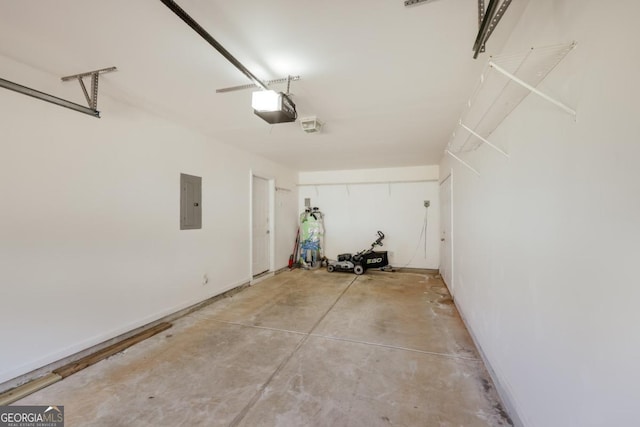 garage featuring electric panel and a garage door opener