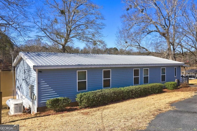 view of side of property with metal roof