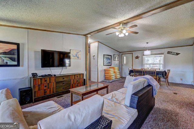 carpeted living area with a textured ceiling, lofted ceiling, a ceiling fan, and ornamental molding