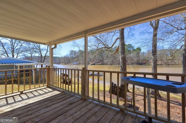 wooden terrace with a water view