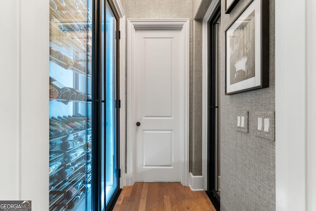 hall featuring wood finished floors