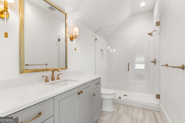 full bathroom with vanity, visible vents, a shower stall, vaulted ceiling, and toilet