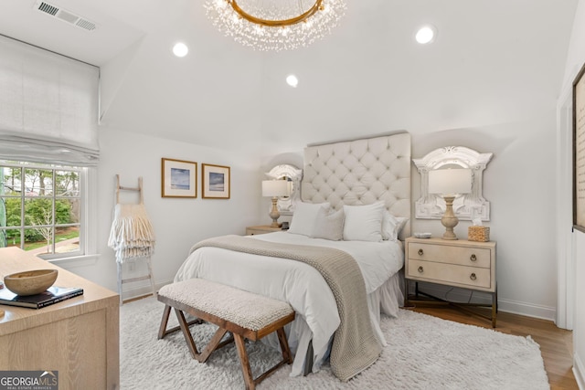 bedroom featuring recessed lighting, visible vents, baseboards, and wood finished floors