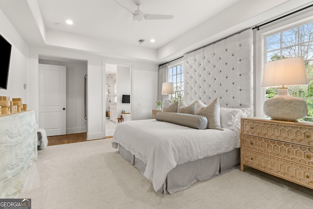 bedroom featuring visible vents, baseboards, recessed lighting, ensuite bath, and a ceiling fan