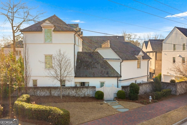 view of property exterior with fence