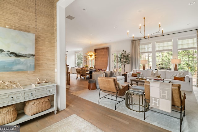 living area with wood finished floors and a chandelier