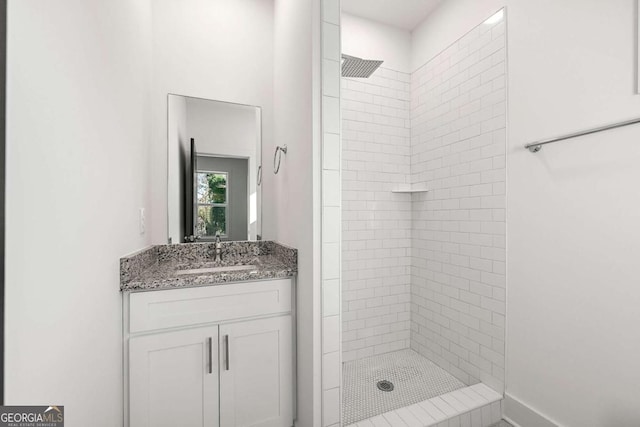 full bathroom featuring a stall shower and vanity