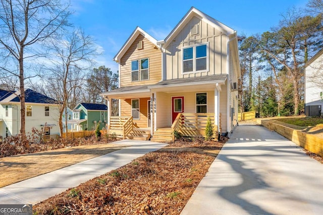 view of front facade with covered porch and board and batten siding