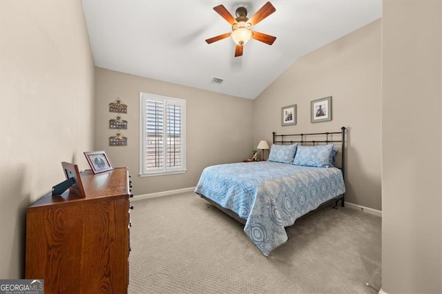 carpeted bedroom featuring vaulted ceiling, baseboards, visible vents, and ceiling fan