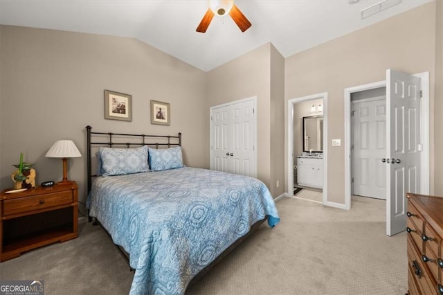 bedroom with light carpet, lofted ceiling, a ceiling fan, a closet, and baseboards