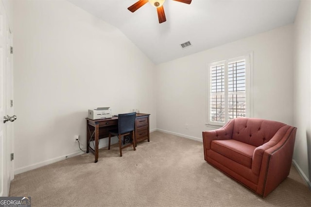 office with visible vents, lofted ceiling, light colored carpet, and baseboards