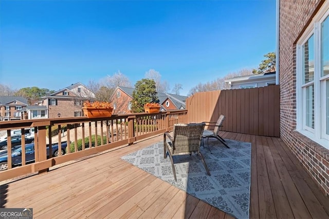 wooden terrace with a residential view