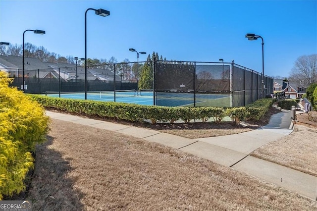 view of tennis court with fence