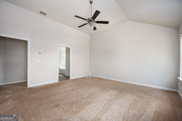 unfurnished bedroom with vaulted ceiling, visible vents, baseboards, and carpet floors