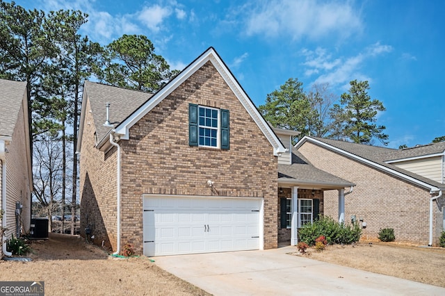 traditional-style home featuring brick siding, central air condition unit, an attached garage, and concrete driveway