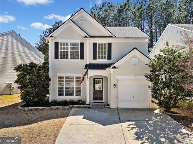 traditional home featuring concrete driveway, stucco siding, metal roof, a garage, and a standing seam roof