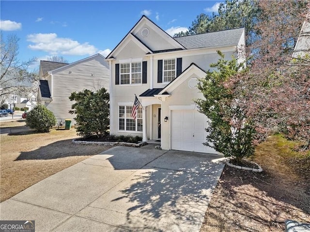 traditional-style home featuring stucco siding, concrete driveway, and an attached garage