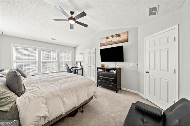 bedroom with vaulted ceiling, baseboards, visible vents, and light carpet