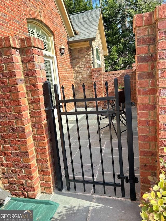 view of gate featuring fence