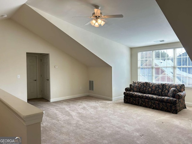 additional living space with light carpet, visible vents, and lofted ceiling