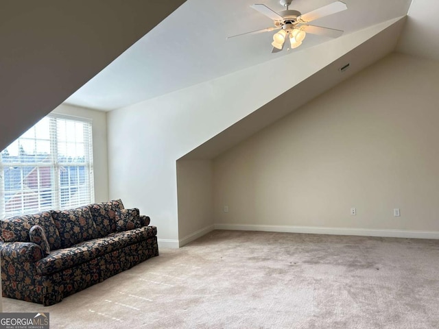 bonus room featuring lofted ceiling, carpet, baseboards, and ceiling fan