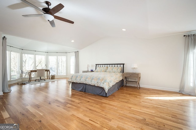 unfurnished bedroom featuring ceiling fan, baseboards, light wood-type flooring, lofted ceiling, and recessed lighting