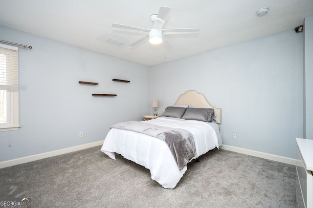 carpeted bedroom with baseboards and ceiling fan