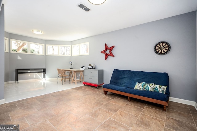 sitting room featuring visible vents and baseboards