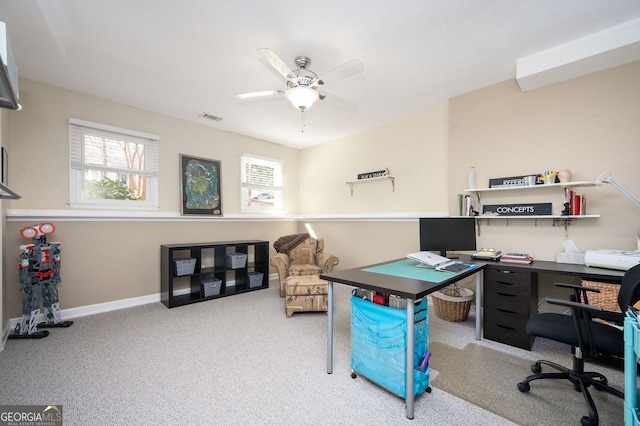 carpeted office space with a ceiling fan, baseboards, and visible vents