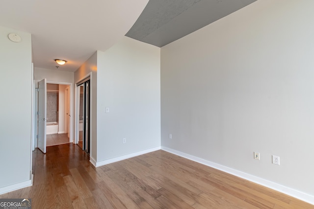 361 17th St Unit 1516, Atlanta, GA 30363 - spare room with light wood-style flooring and a smoke detector