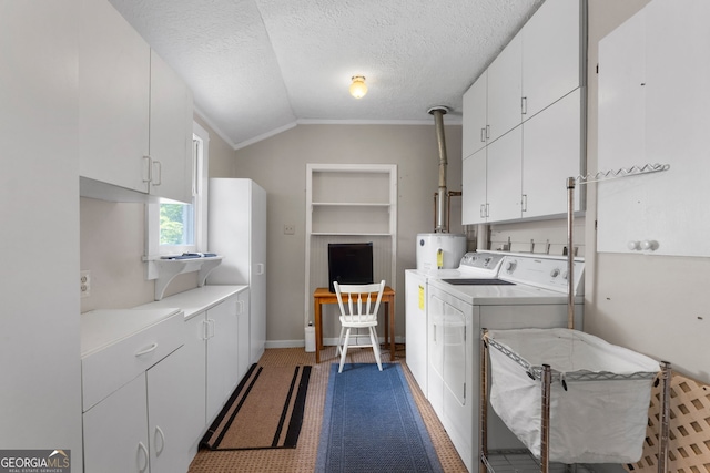 washroom featuring built in shelves, baseboards, washing machine and clothes dryer, cabinet space, and a textured ceiling