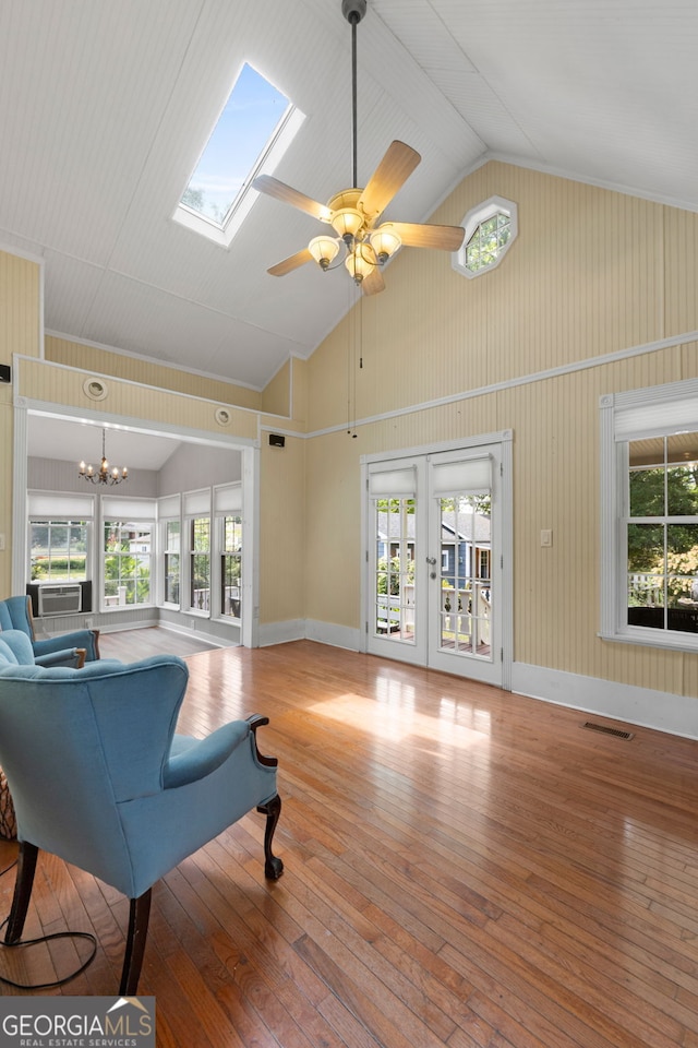 living room with french doors, visible vents, wood-type flooring, and high vaulted ceiling