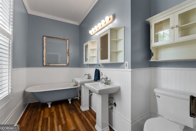 full bath with wood finished floors, wainscoting, toilet, and ornamental molding