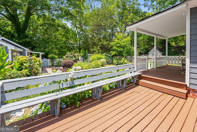 wooden deck featuring fence