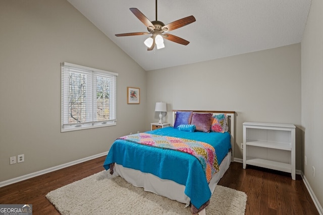 bedroom with vaulted ceiling, wood finished floors, baseboards, and ceiling fan