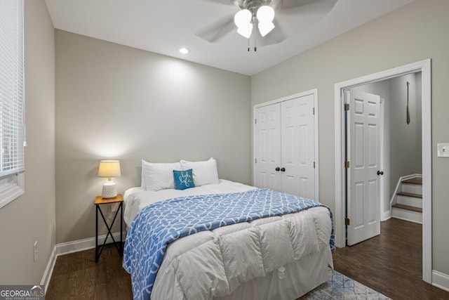 bedroom with a closet, baseboards, and wood finished floors