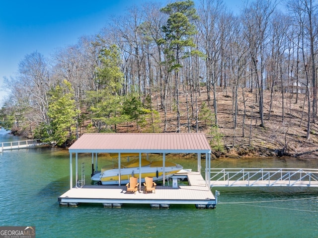 dock area featuring a water view and boat lift