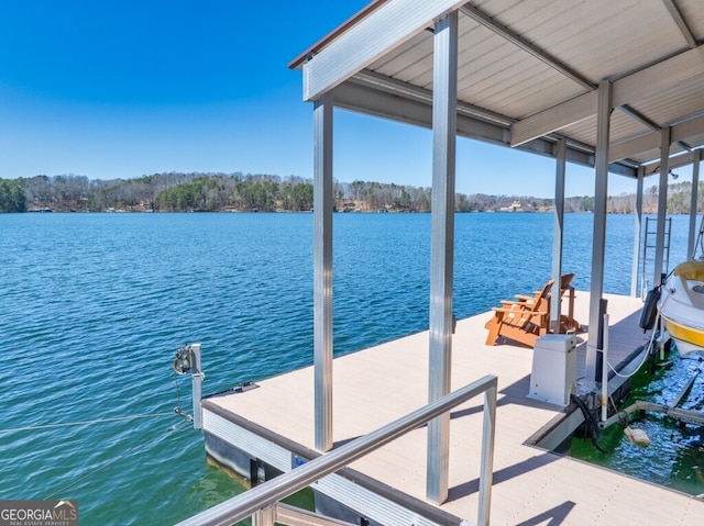 dock area featuring boat lift and a water view