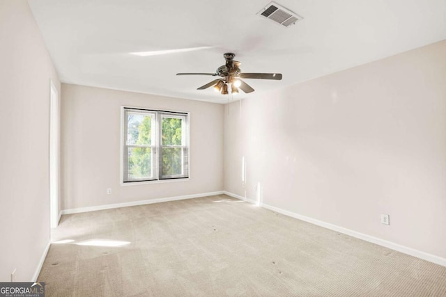 unfurnished room featuring visible vents, ceiling fan, baseboards, and carpet floors