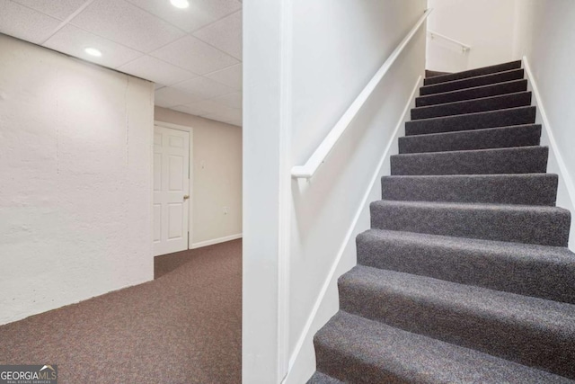 staircase with recessed lighting, carpet, and a paneled ceiling