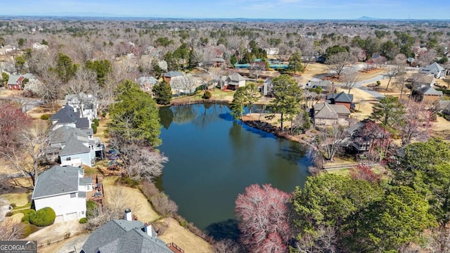 drone / aerial view with a water view and a residential view